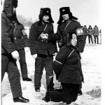 Wang Shouxin refuses to kneel down before being shot to death, but the soldiers force her by kicking her knee  (Photo: LI ZHENSHENG)
