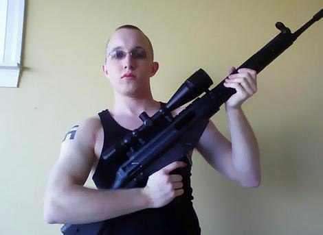 Stormfront Member Daniel Cowart with Swastika Tattoo and Rifle (Photo: 