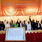 Indonesia Central Library Meeting with Flag of Islamic Supremacist Caliphate and Raised Fists Against U.S. President Barack Obama