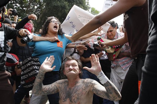 Los Angeles Nazi Rally - Man with Swastika Tattoos Being Attacked (Photo: 