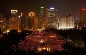 Tens of thousands of people attend a candlelight vigil at Hong Kong's Victoria park Thursday, June 4, 2009, to mark the 20th anniversary of the June 4th military crackdown on the pro-democracy movement in Beijing. (AP Photo/Vincent Yu)