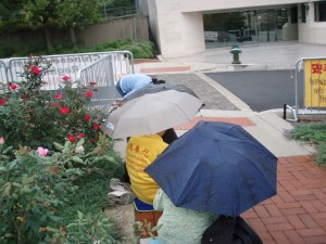 Falun Dafa Protesters Continue in the Rain at the DC PRC Embassy