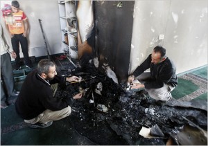 NYT: "On Friday, Palestinians inspected the damage done to a mosque that was set on fire in the West Bank village of Yasuf." (Jaafar Ashtiyeh/Agence France-Presse — Getty Images)