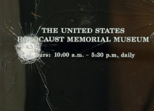 Bullet strikes are seen in one of the doors to the United States Holocaust Memorial Museum after a shooting left a security officer dead and the gunman wounded in Washington Thursday, June 11, 2009.(AP Photo/Alex Brandon)