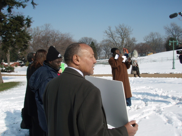Damanga's Mohamed Yahya Speaks into Megaphone at Capitol Rally