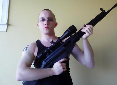 Stormfront Member Daniel Cowart with Swastika Tattoo and Rifle (Photo: Inquister)