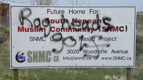 Canada's CTV: "Local residents discovered vulgar words on this sign on Woodroffe Avenue, marking the future site of a mosque and Muslim community centre, Friday, April 30, 2010." (Photo: CTV)