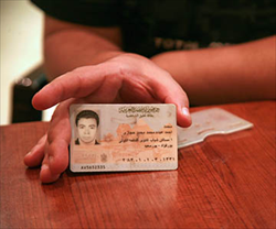 Mohammed Hegazy Holding Identity Card (Photo: Compass)