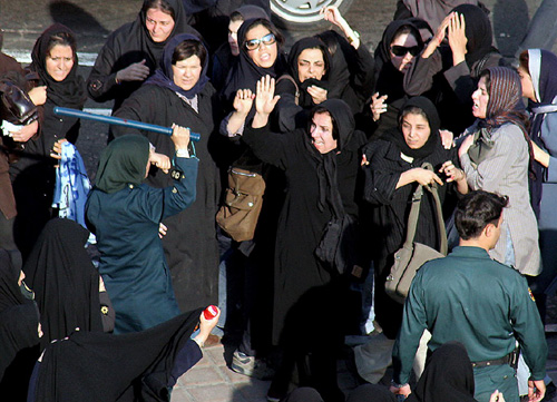 police beats women during a protest gathering in Tehran (2007 Payvand file photo)