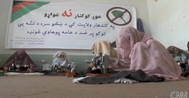 women being taught to sow by Rana Tarin, then allowed to take sowing machine home - "the only safe place for a woman in Kandahar to work" (Photo: CNN clip)