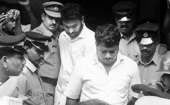 Ashraf and Jaffar, who were arrested in connection with the attack on Professor T.J. Joseph at Muvattupuzha, coming out of a court after being remanded to judicial custody.  (Photo: The Hindu)